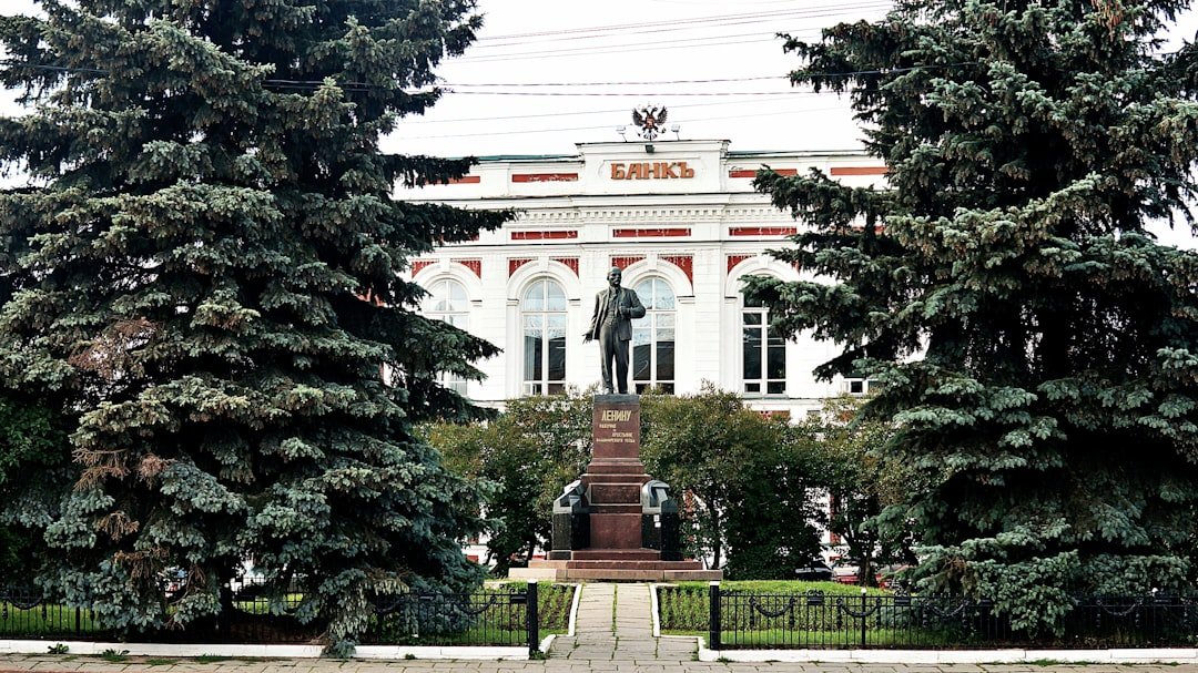 Statue of lenin in front of a building.