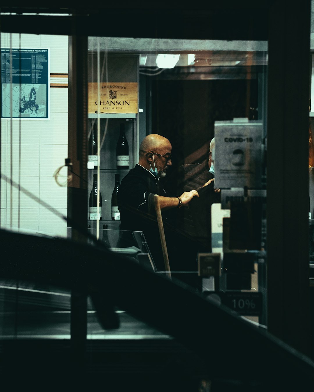 man in black jacket sitting on black chair