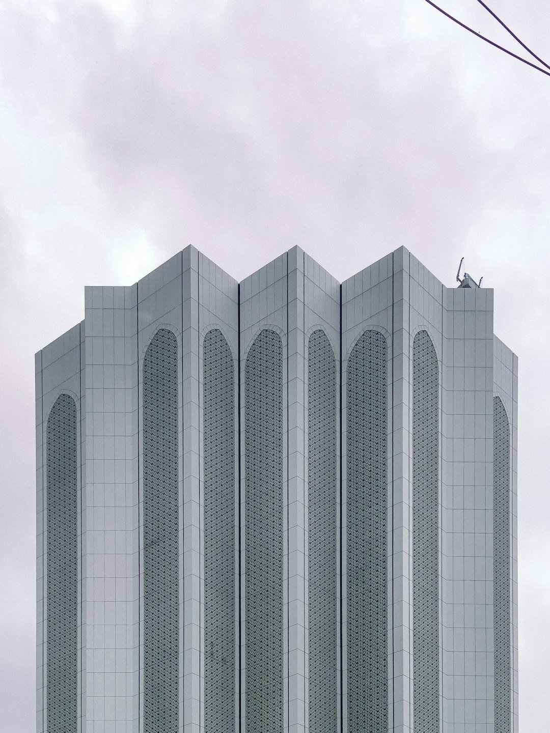Modern skyscraper with distinctive geometric facade