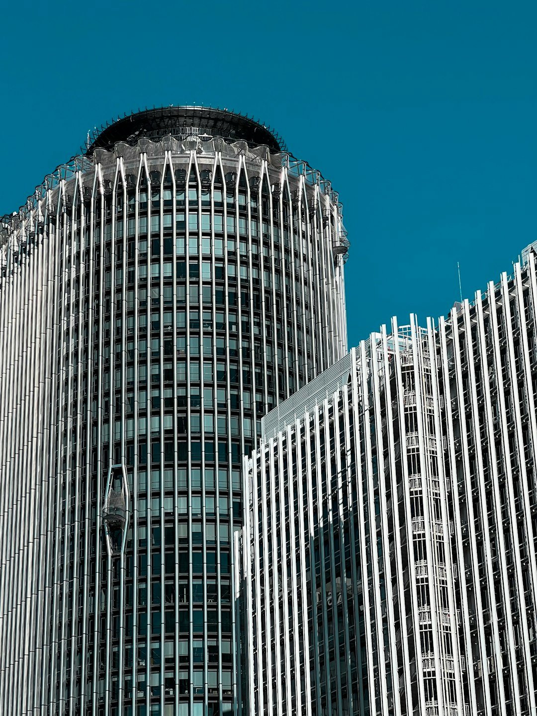 a very tall building with a clock on it's side