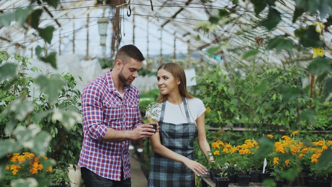 Couple shopping for plants in a greenhouse
