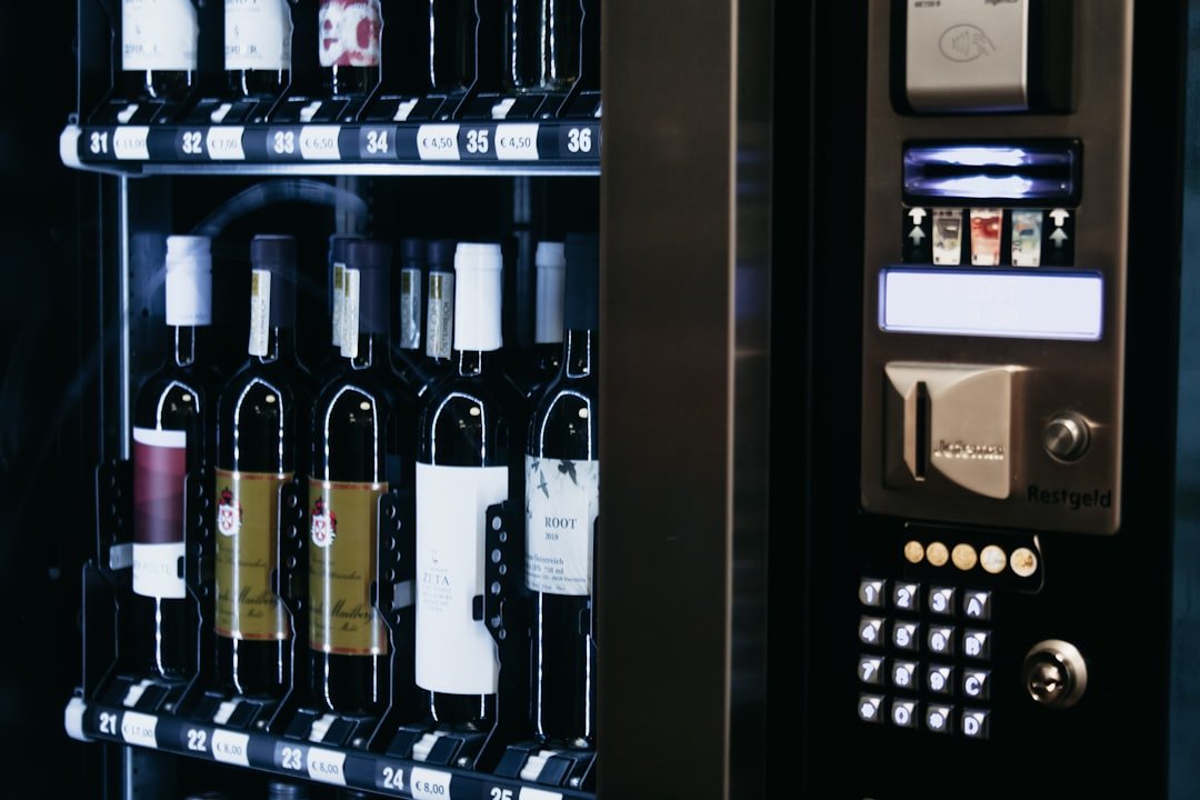 A vending machine with many bottles of wine
