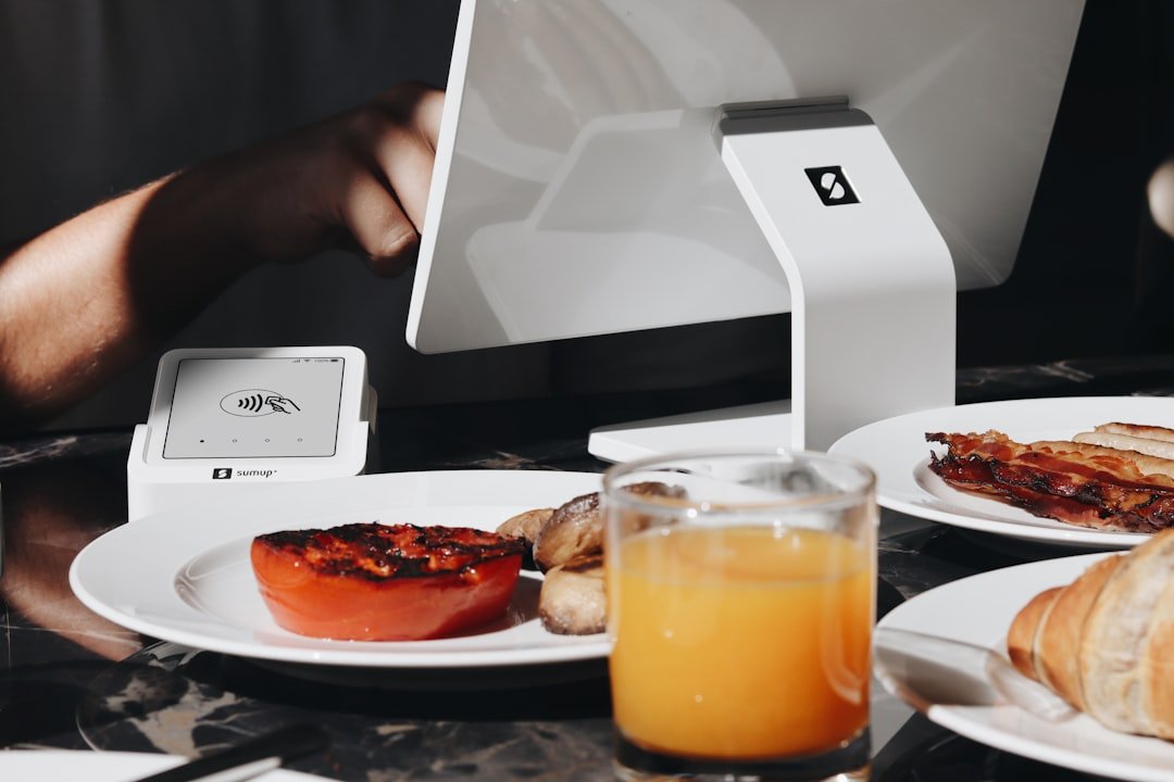 A person sitting at a table with a plate of food