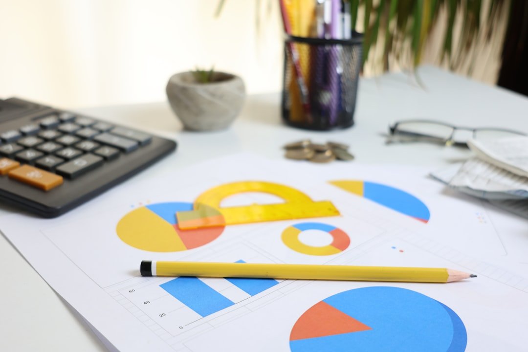 Desk with calculator, charts, and pencil
