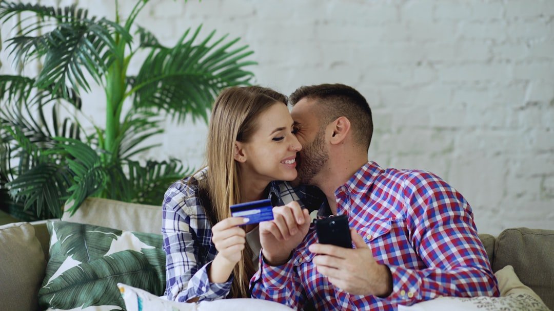 Couple holding credit card and phone, smartphone,phone, phone
