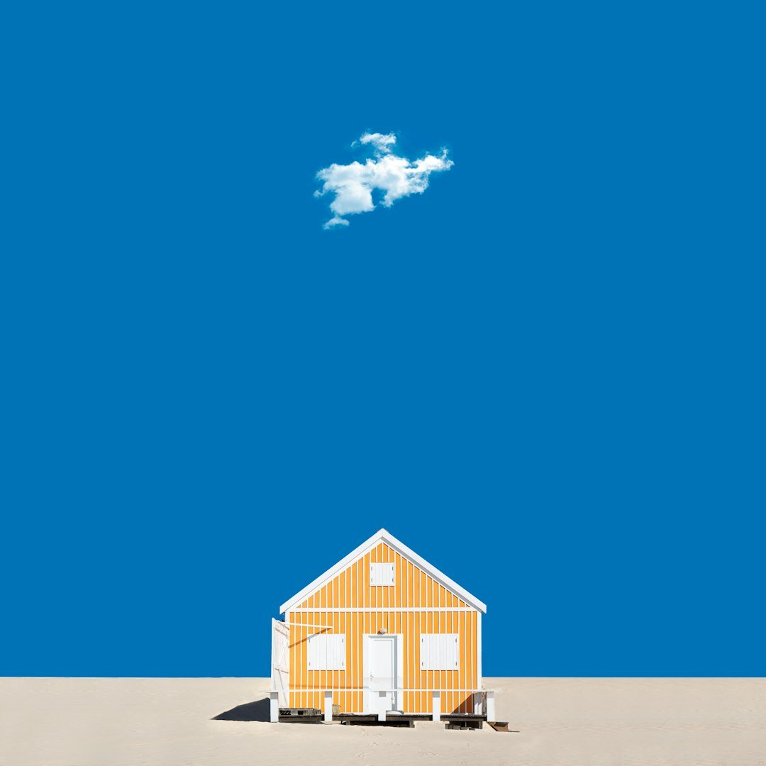 white and brown wooden house under blue sky during daytime
