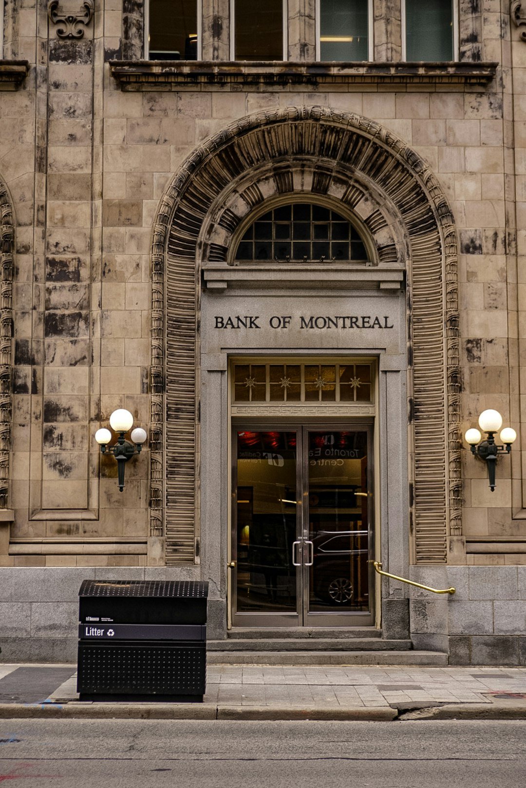 a large stone building with a clock on the front of it