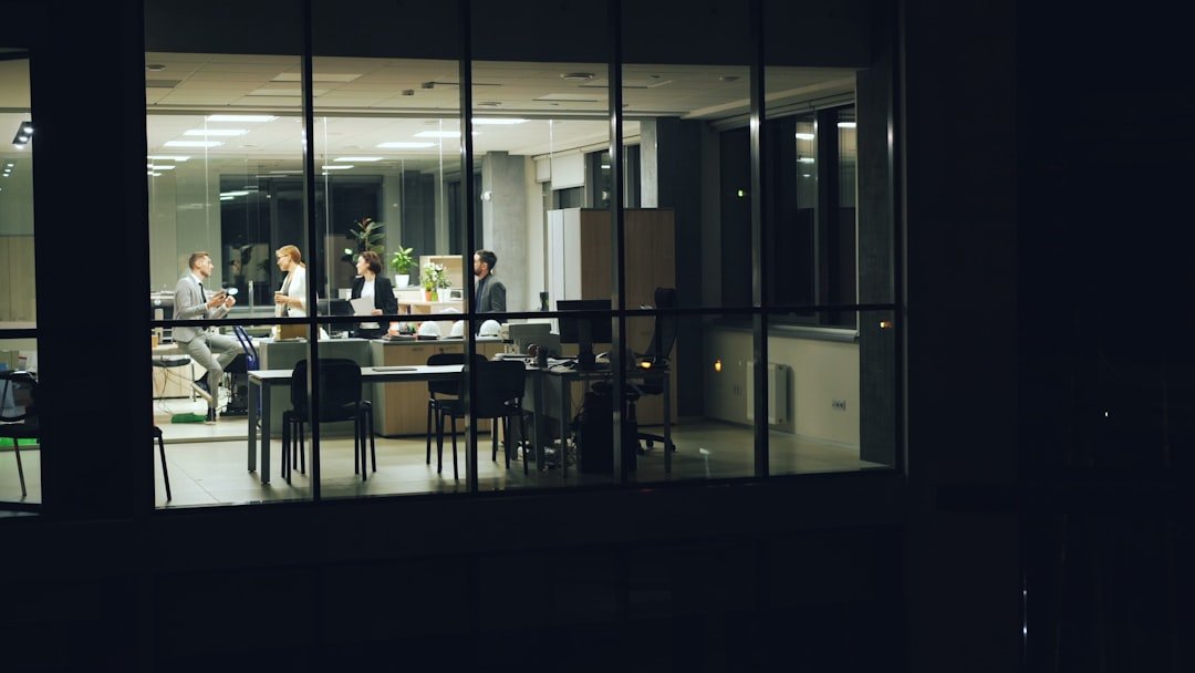 People working late in a modern office at night