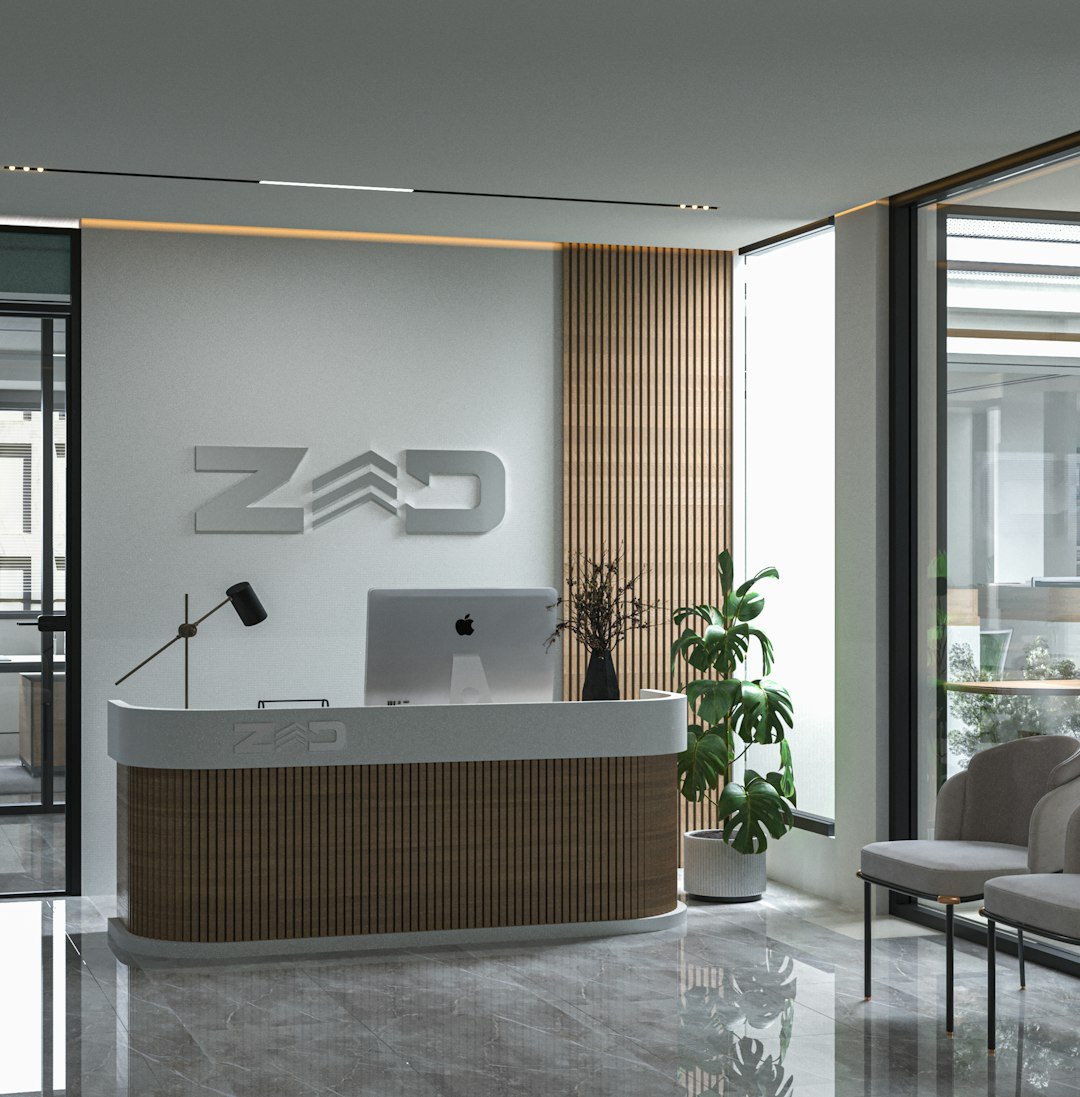 a reception desk with a laptop on top of it