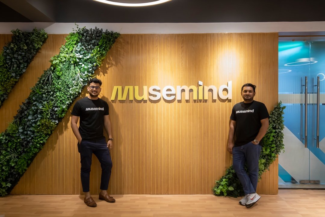 two men standing in front of a museum sign