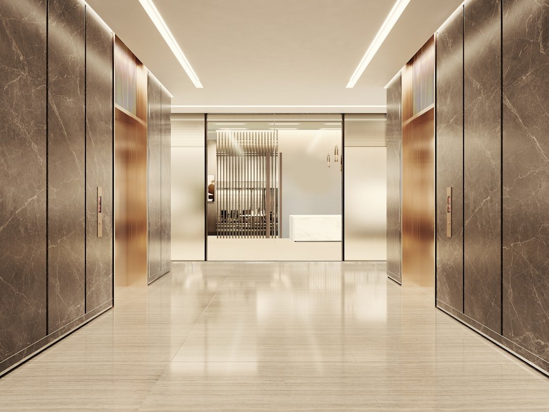 Modern elevator lobby with marble and glass accents
