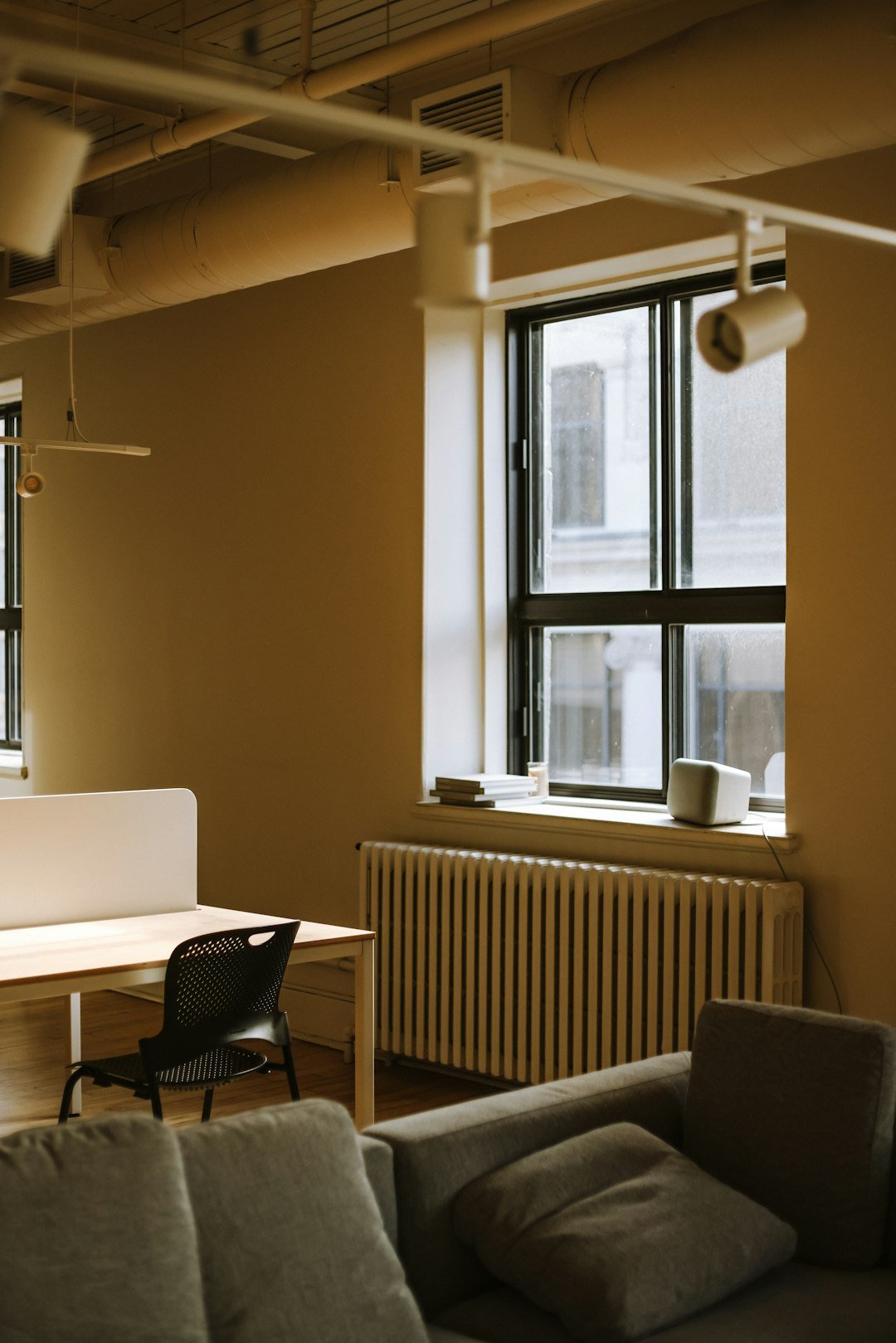 A living room filled with furniture and windows