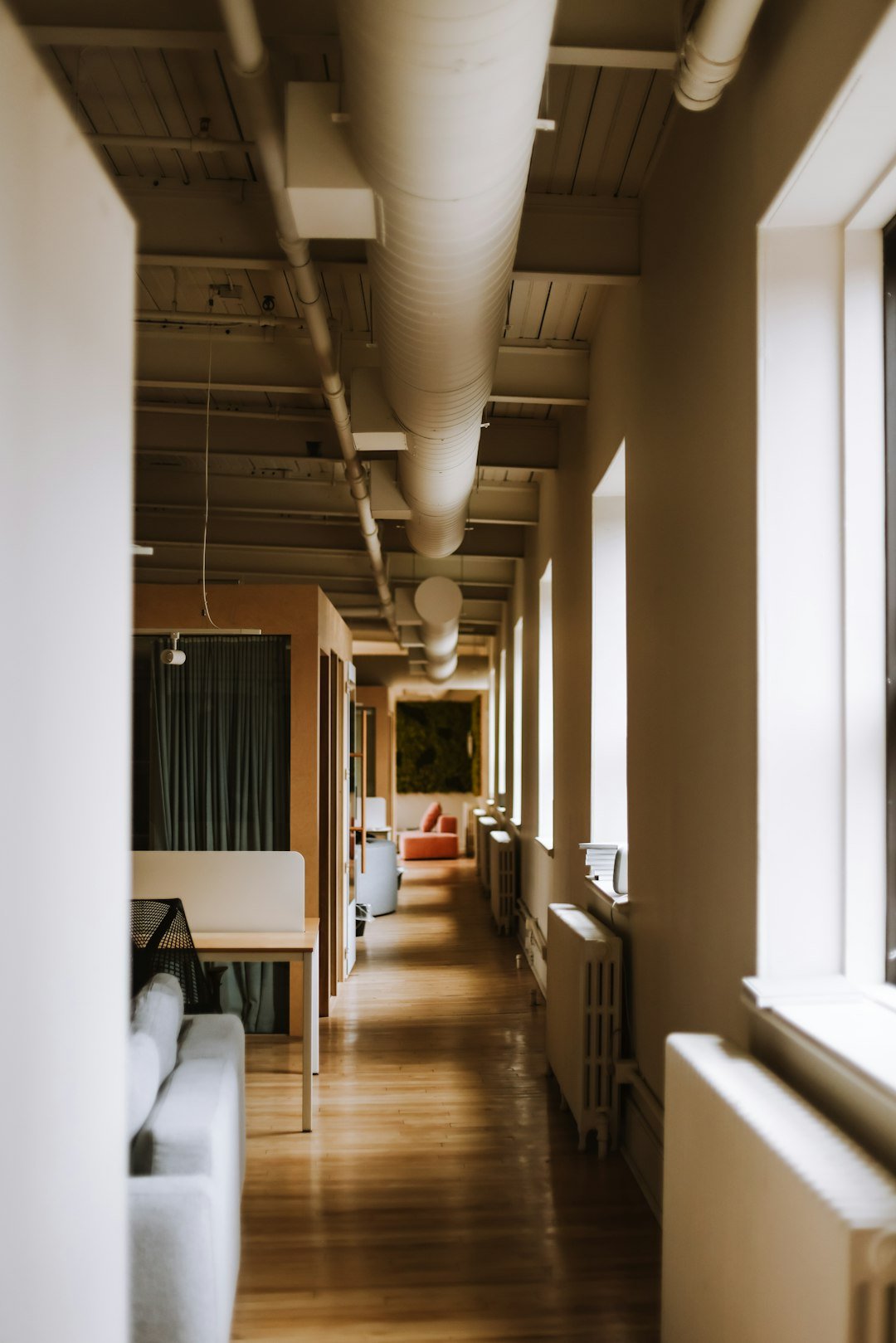A long hallway leading to a living room and dining room