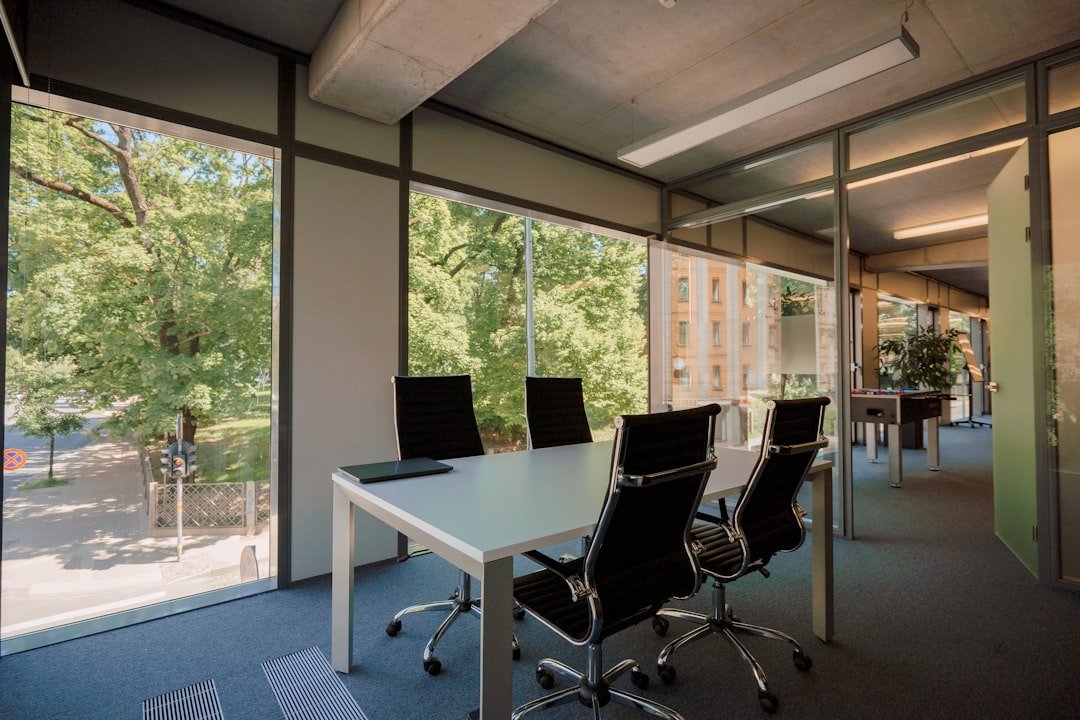 a conference room with a large table and chairs