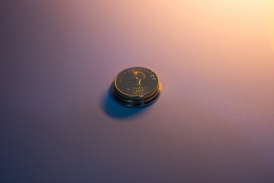 A stack of coins reflects light.